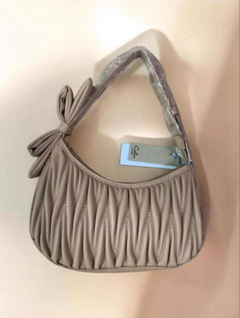 Small Quilted Bow Shoulder Bag in Beige